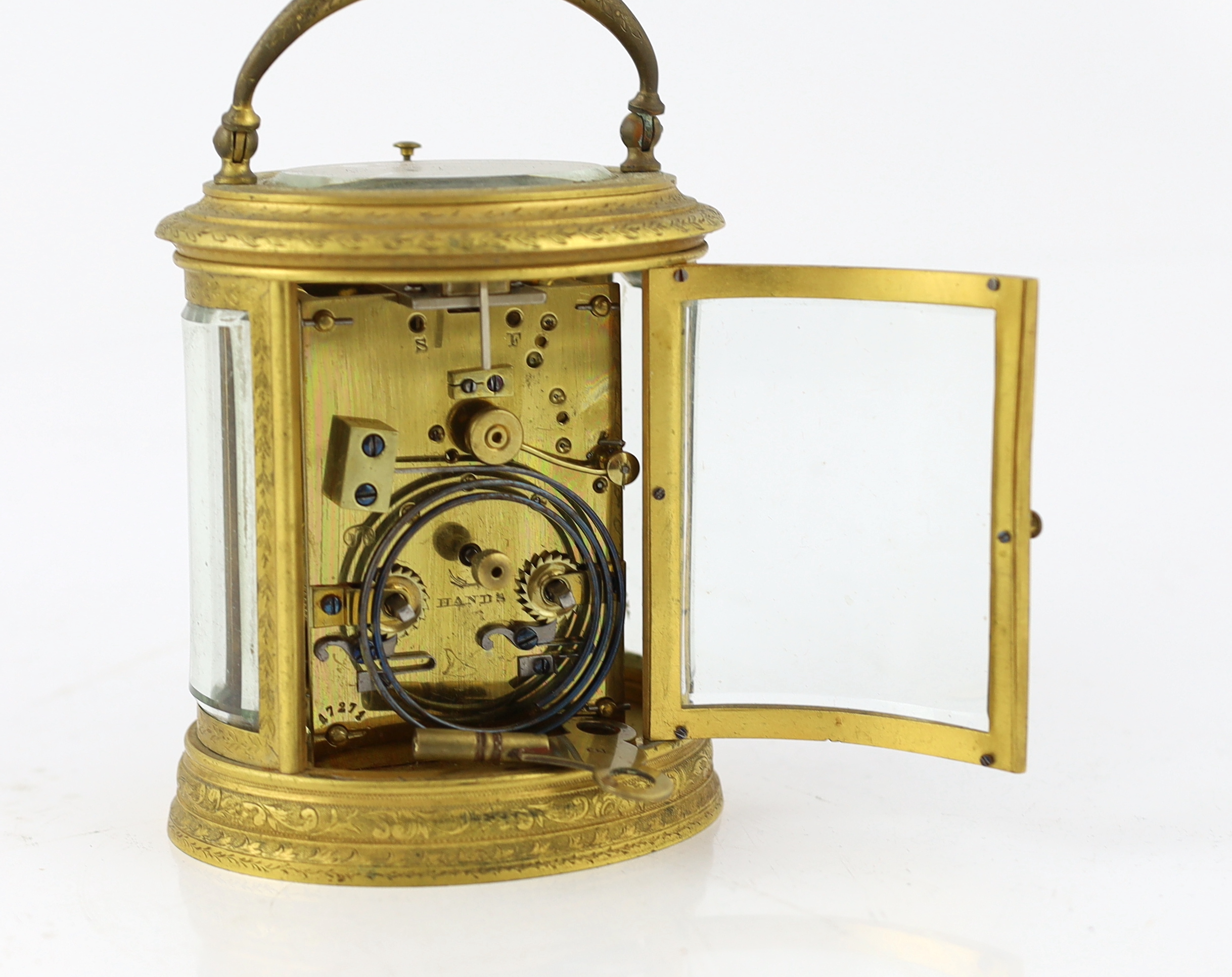 Drocourt & Co., a late 19th century French hour repeating ormolu oval cased carriage clock, 13.5cm high